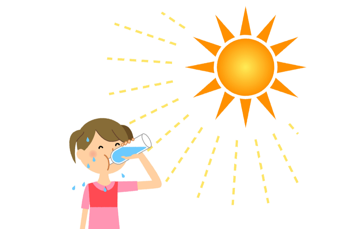 A girl drinking water in hot weather in Texas.