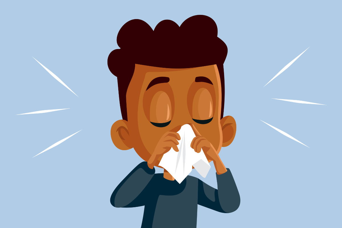 A boy with a nosebleed wiping his nose with tissue in Texas.